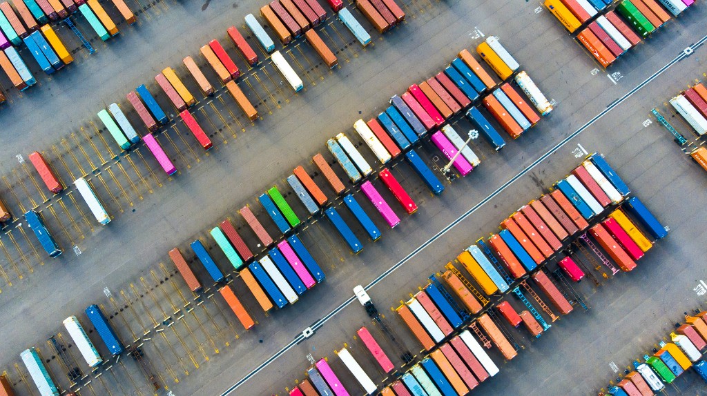 Aerial view of colorful shipping containers in a logistics yard